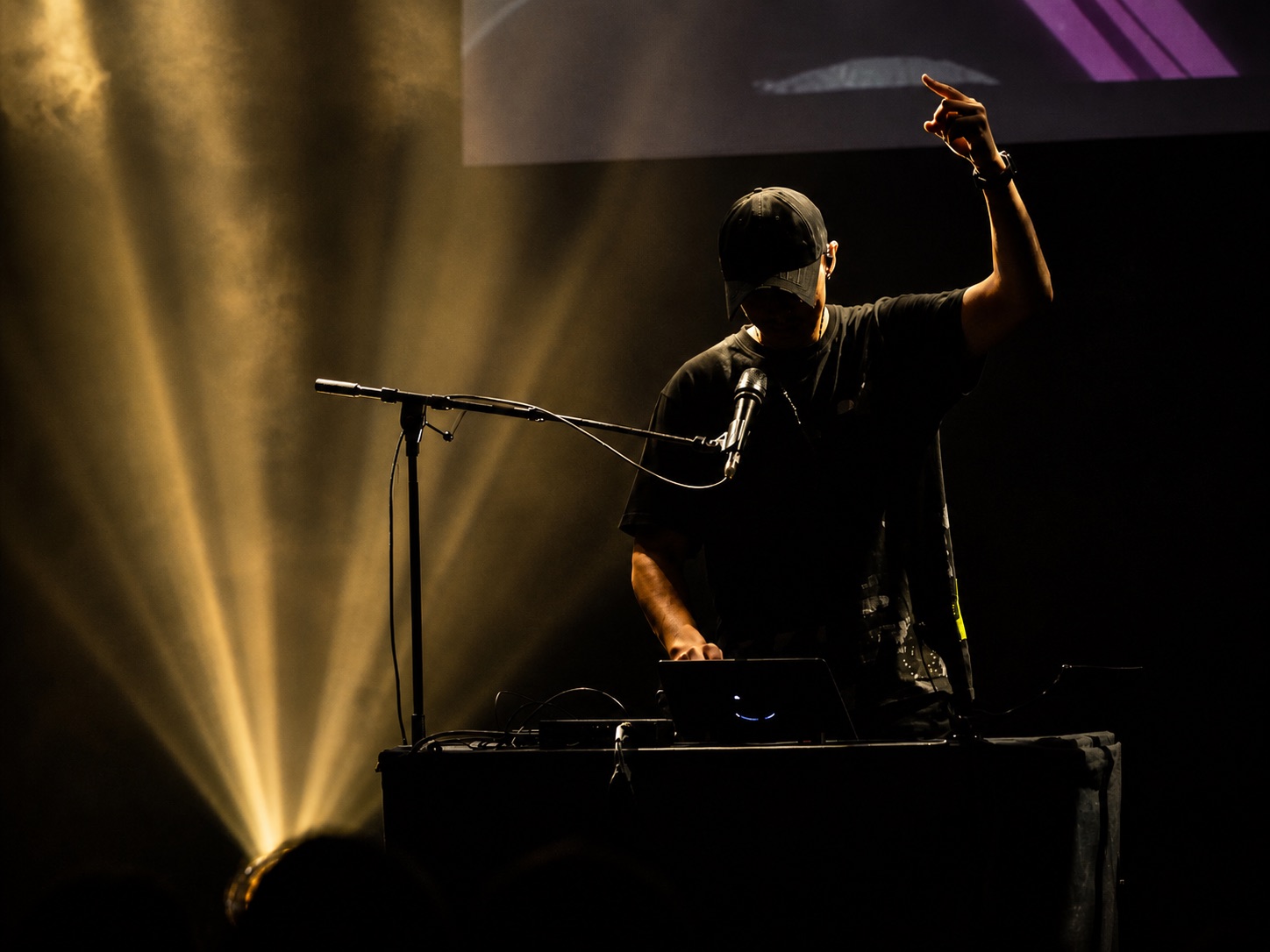 Inkie performing with Loopy Pro in a vivid electronic stage setup